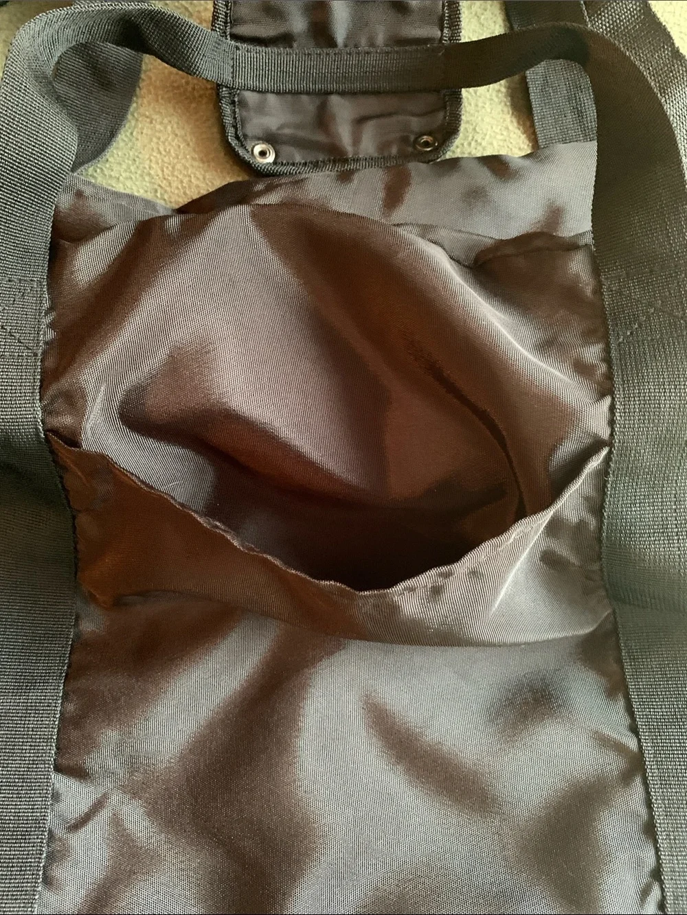 EUC black nylon duffel bag with strap. Approximately 22” x 14” x 10.5”